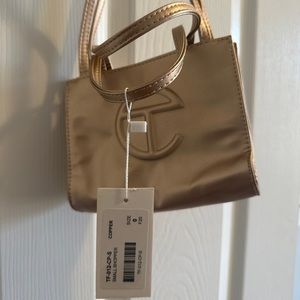 Small Telfar gold bag
